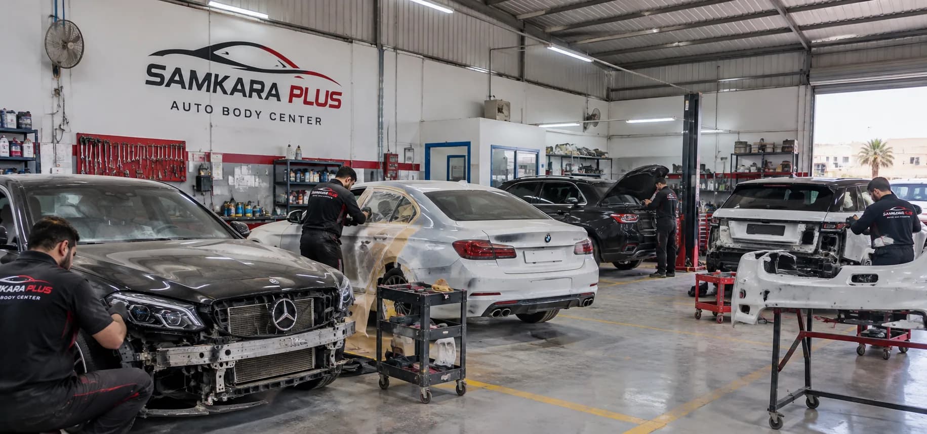 An organised body shop with cars under repair